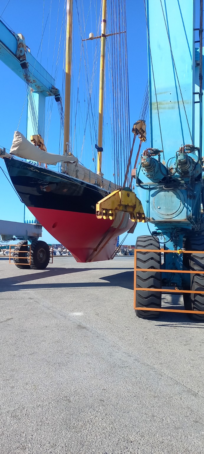 Classic sailing yacht ashore during maintenance